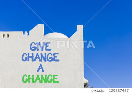Give change a chance symbol. Concept words phrase Give change a chance on beautiful white wall. Beautiful white wall and blue sky background. Business Give change a chance concept. Copy space. 129287487
