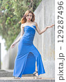 Elegant Woman in Blue Strapless Gown Posing 129287496