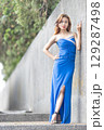Elegant Woman in Blue Strapless Gown Posing 129287498