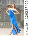 Elegant Woman in Blue Strapless Gown Posing 129287499