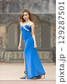 Elegant Woman in Blue Strapless Gown Posing 129287501