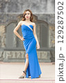 Elegant Woman in Blue Strapless Gown Posing 129287502