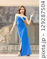 Elegant Woman in Blue Strapless Gown Posing 129287504