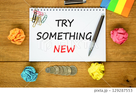 Try something new symbol. Concept words Try something new on beautiful white note. Colored paper. Beautiful wooden background. Business motivational lifestyle try something new concept. Copy space. Try something new symbol. Concept words Try something new on beautiful white note. Colored paper. Beautiful wooden background. Business motivational lifestyle try something new concept. Copy space. 129287553