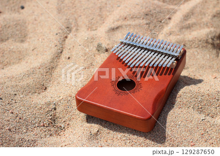 Kalimba on Sandy Shoreline Kalimba on Sandy Shoreline 129287650