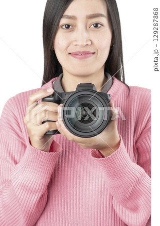 Woman Holding Black Mirrorless Camera Front View (Isolated) Woman Holding Black Mirrorless Camera Front View (Isolated) 129287868