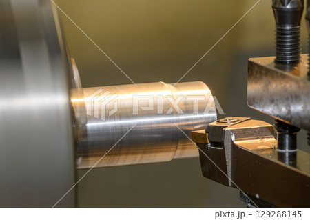 Closeup scene the lathe machine finish cut the metal parts. Closeup scene the lathe machine finish cut the metal parts. 129288145