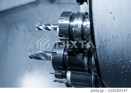 The hole tool in the tool magazine of machining center in the blue tone scene. 129288147
