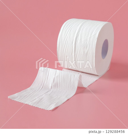 Tissue rolls of toilet paper lying on pink background. 129288456