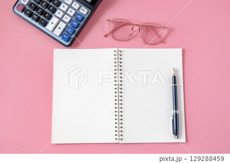 Top view of notebook and pen on background. 129288459