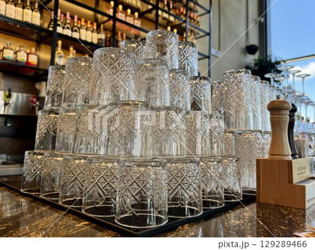 clean glasses on the bar counter. High quality photo clean glasses on the bar counter. High quality photo 129289466