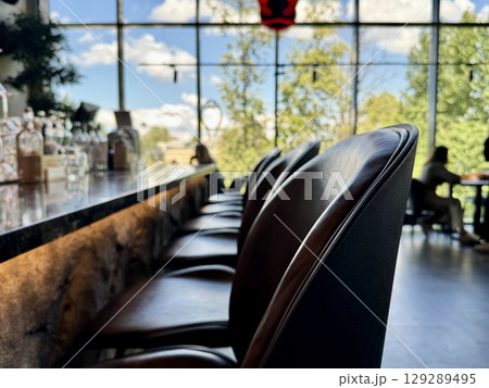 modern interior of the restaurant, leather chairs at the bar. High quality photo 129289495
