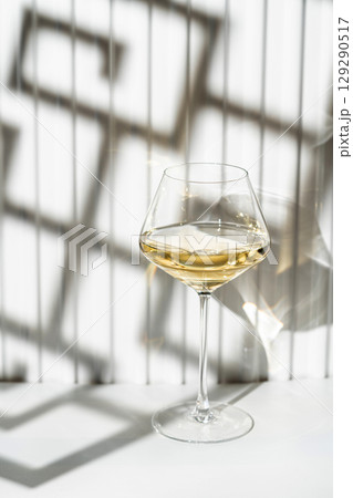 A glass of white wine A glass of white wine 129290517