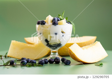 Diet fruit yogurt with melon blueberries and aromatic greens Diet fruit yogurt with melon blueberries and aromatic greens 129290705