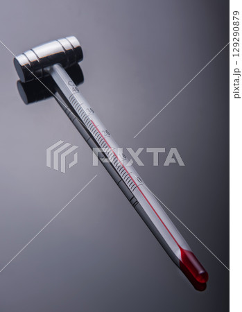 Thermometer for wine on a  black background 129290879