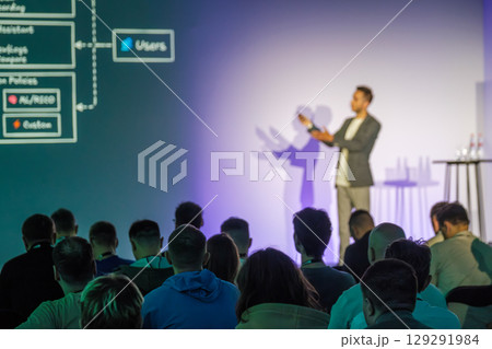 Speaker Presenting Topic in a Conference Room with an Engaged Audience Speaker Presenting Topic in a Conference Room with an Engaged Audience 129291984