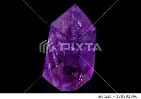 Macro mineral stone Amethyst crystal on a black background 129292966