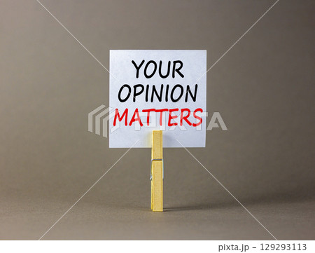Your opinion matters symbol. Concept words Your opinion matters on beautiful white paper on clothespin. Beautiful grey background. Business your opinion matters concept. Copy space. 129293113