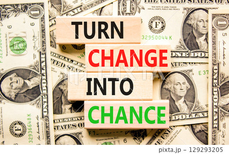 Turn change into chance symbol. Concept words phrase Turn change into chance on beautiful blocks. Dollar bills. Beautiful dollar bills background. Business Turn change into chance concept. Copy space. 129293205