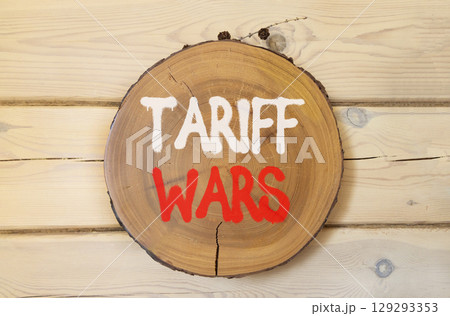 Trade tariff wars symbol. Concept word Tariff wars on beautiful wooden circle on wooden wall. Beautiful wooden wall background. Business trade tariff wars concept concept. Copy space. Trade tariff wars symbol. Concept word Tariff wars on beautiful wooden circle on wooden wall. Beautiful wooden wall background. Business trade tariff wars concept concept. Copy space. 129293353