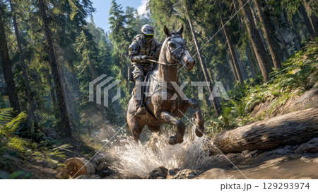 A rider in tactical gear jumps over a muddy stream in the forest 129293974