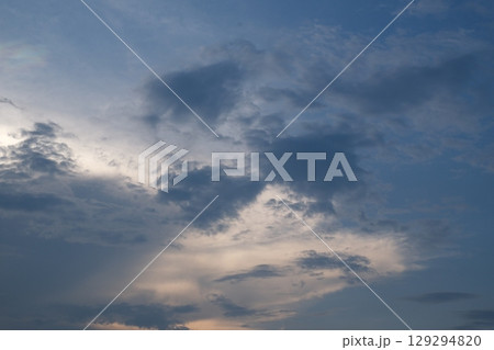 Sunset cloudy sky Stormy sky with dramatic clouds from an approaching thunderstorm at sunset 129294820