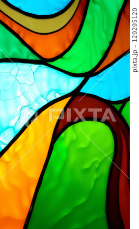 Multi-colored bright vintage stained glass window 129295120