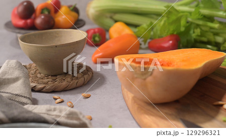 Autumn vegetables arranged on a kitchen worktop 129296321