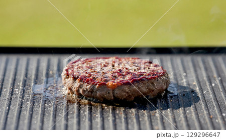 burger meat on hot grill in garden burger meat on hot grill in garden 129296647