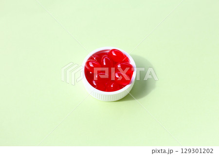 Red softgel Q10 capsules for dietary supplement. Red softgel Q10 capsules for dietary supplement. 129301202