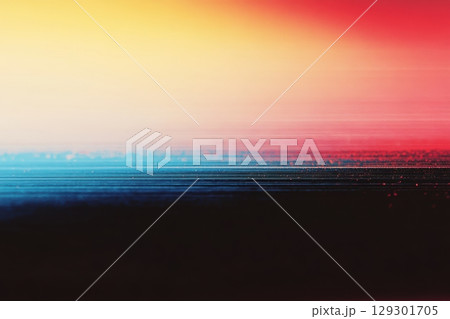 Vibrant sunset blending colors over a calm horizon at the beach 129301705