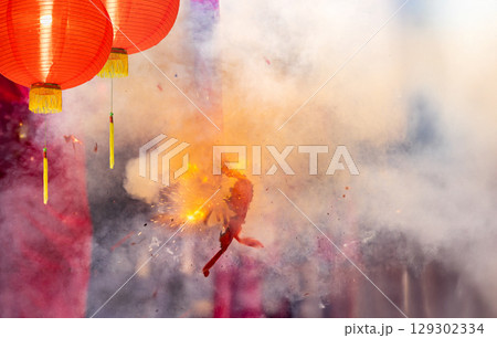 Traditional Chinese firecrackers are exploding with flashes and smoke in Lunar new year. Traditional Chinese firecrackers are exploding with flashes and smoke in Lunar new year. 129302334