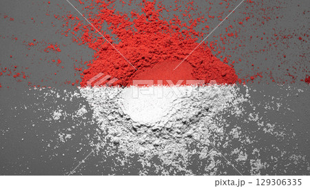 Closeup view of the red and white colors of the Indonesian national flag with a black wall background. Celebrate Indonesia Independence Day. Concept of Kemerdekaan Indonesia 129306335