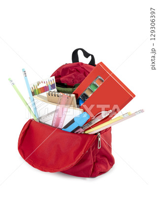 The backpack opens with the arrangement of school supplies isolated over a white background. Copy space. Concept of Back to School The backpack opens with the arrangement of school supplies isolated over a white background. Copy space. Concept of Back to School 129306397