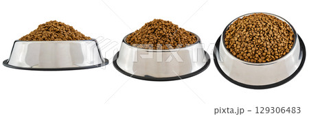 Set of dog and cat dry food on a stainless steel bowl isolated over a white background 129306483