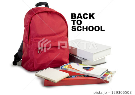 The backpack opens with the arrangement of school supplies and a message of Back to School on a white background. Concept of Back to School The backpack opens with the arrangement of school supplies and a message of Back to School on a white background. Concept of Back to School 129306508