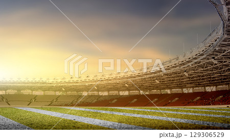 Yard line on the turf of an American football green field stadium with a sunset scene background 129306529