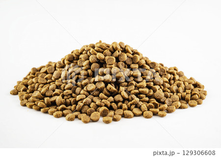 Dog and cat dry food splattered isolated over a white background 129306608