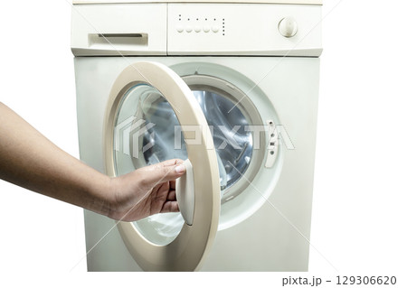 Human hand opening the washing machine drum door isolated over a white background. Home appliance 129306620