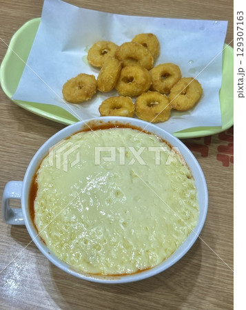 Spicy tteokbokki with chewy rice cakes in a rich, flavorful sauce, paired with crispy twigim for the perfect Korean street food combo. A delicious mix of spicy, crunchy, and savory flavors! Spicy tteokbokki with chewy rice cakes in a rich, flavorful sauce, paired with crispy twigim for the perfect Korean street food combo. A delicious mix of spicy, crunchy, and savory flavors! 129307163