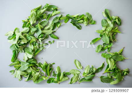 Bunch of fresh aromatic mint on gray textured background 129309907