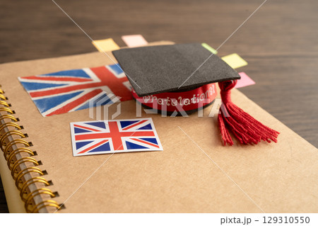 UK flag with graduate hat on english language book. 129310550
