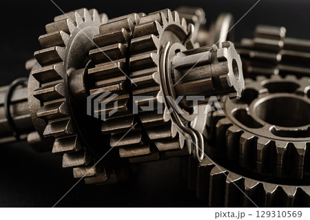 Gear and cogs wheels, clock mechanism, brass metal engine industrial. 129310569