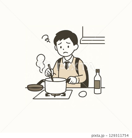 困った顔で料理をする中学生の男の子 129311754