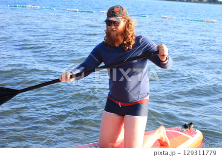 Bold Paddleboarding Adventure 129311779