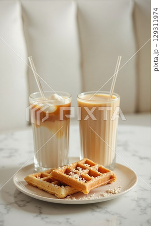 coffee moment, two iced lattes in tall ribbed glass 129311974