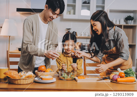 Family spends their free time together Family spends their free time together 129313909