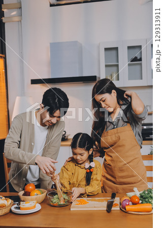 Family spends their free time together Family spends their free time together 129313911