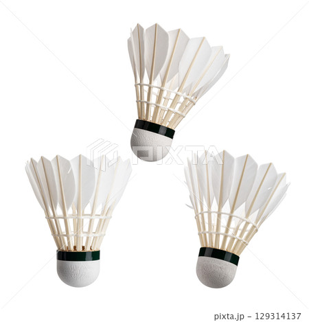 Isolated white badminton shuttlecock with racket on white background Isolated white badminton shuttlecock with racket on white background 129314137