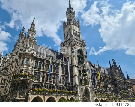 Munich, Germany - July 27, 2025: Facade of the Cathedral Church of Our Lady, Frauenkirche, Munich's most famous church and its two towers are landmarks of the city Munich, Germany - July 27, 2025: Facade of the Cathedral Church of Our Lady, Frauenkirche, Munich's most famous church and its two towers are landmarks of the city 129314789